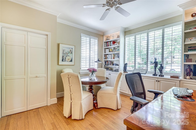 1021 Isleworth Ave, Charlotte, NC 28203 - dining room featuring light wood finished floors, ceiling fan, healthy amount of natural light, ornamental molding, and a desk
