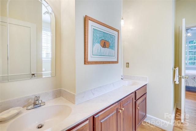 1021 Isleworth Ave, Charlotte, NC 28203 - bathroom with double vanity and wood finished floors