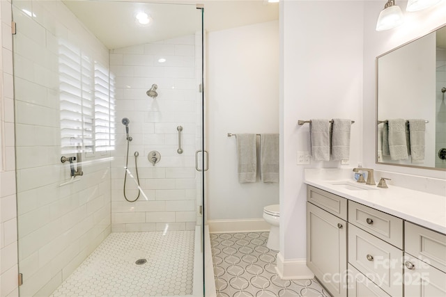 1021 Isleworth Ave, Charlotte, NC 28203 - bathroom with a stall shower, vanity, toilet, baseboards, and tile patterned floors