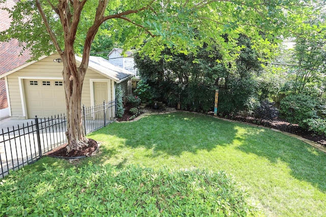 1021 Isleworth Ave, Charlotte, NC 28203 - view of yard with an outdoor structure, a detached garage, and concrete driveway