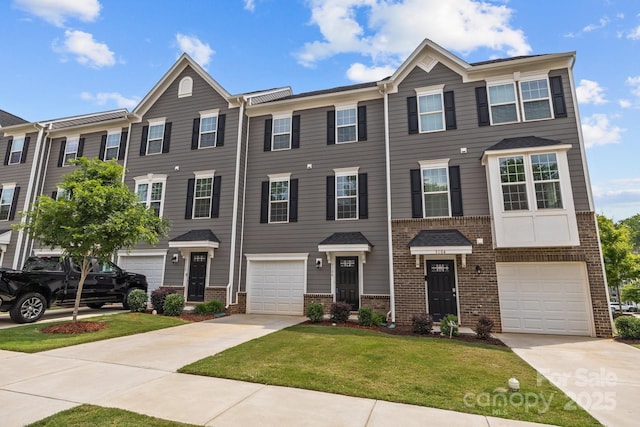 3108 Beeler Ln, Charlotte, NC 28208 - view of property with driveway, brick siding, a front yard, and an attached garage