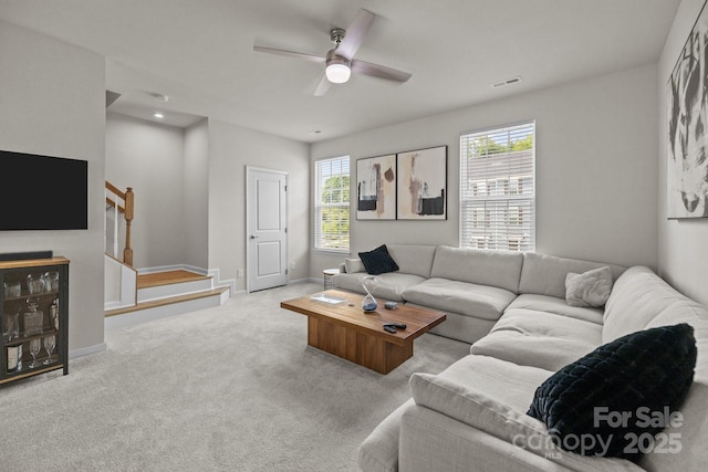3108 Beeler Ln, Charlotte, NC 28208 - living area featuring plenty of natural light, carpet flooring, stairway, and ceiling fan