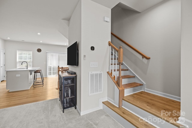 3108 Beeler Ln, Charlotte, NC 28208 - staircase featuring wood finished floors, baseboards, and recessed lighting