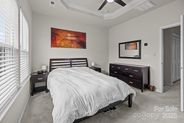 3108 Beeler Ln, Charlotte, NC 28208 - bedroom with multiple windows, light colored carpet, a raised ceiling, ornamental molding, and a ceiling fan