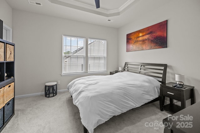 3108 Beeler Ln, Charlotte, NC 28208 - carpeted bedroom featuring ornamental molding, a tray ceiling, baseboards, and a ceiling fan