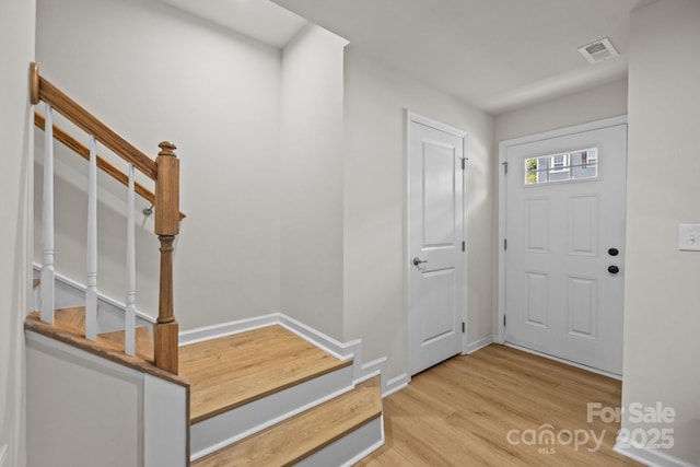 3108 Beeler Ln, Charlotte, NC 28208 - entrance foyer with stairs, wood finished floors, and baseboards
