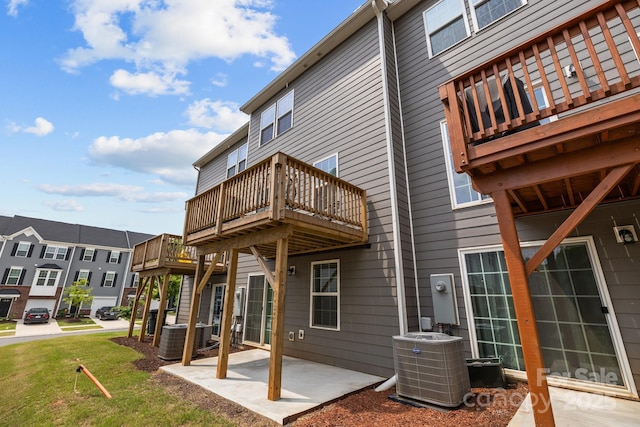 3108 Beeler Ln, Charlotte, NC 28208 - rear view of property featuring central AC unit, a patio area, a lawn, and a balcony
