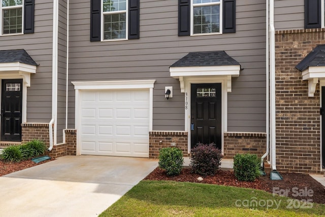 3108 Beeler Ln, Charlotte, NC 28208 - doorway to property with brick siding, a garage, and concrete driveway