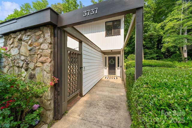 3737 Winding Creek Ln, Charlotte, NC 28226 - doorway to property with stone siding