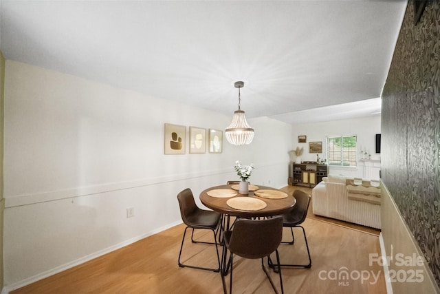 3737 Winding Creek Ln, Charlotte, NC 28226 - dining area with wood finished floors and baseboards