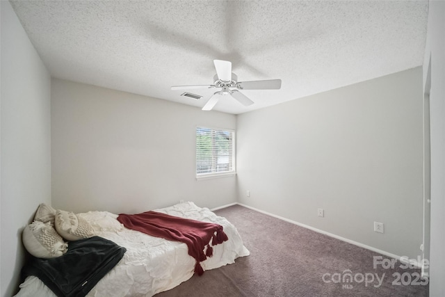 3737 Winding Creek Ln, Charlotte, NC 28226 - carpeted bedroom featuring baseboards, a ceiling fan, and a textured ceiling