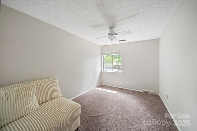 3737 Winding Creek Ln, Charlotte, NC 28226 - living area featuring carpet, ceiling fan, baseboards, and a textured ceiling