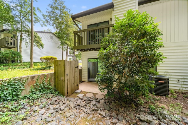 3737 Winding Creek Ln, Charlotte, NC 28226 - back of house with a balcony, central AC unit, and a gate