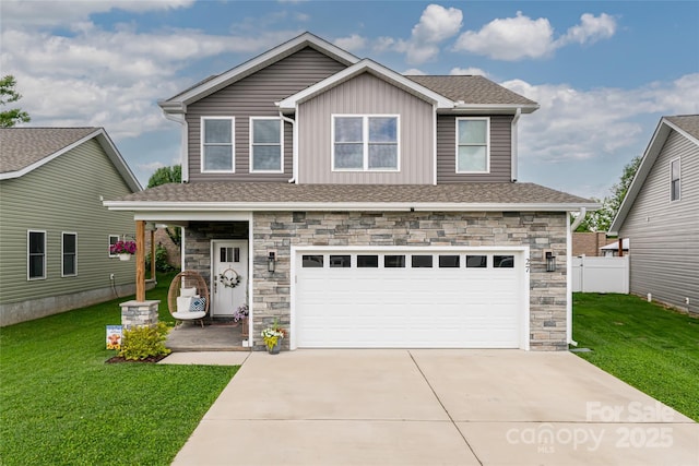 27 Sage Crest Loop, Weaverville, NC 28787 - view of front facade with stone siding, an attached garage, concrete driveway, board and batten siding, and a shingled roof