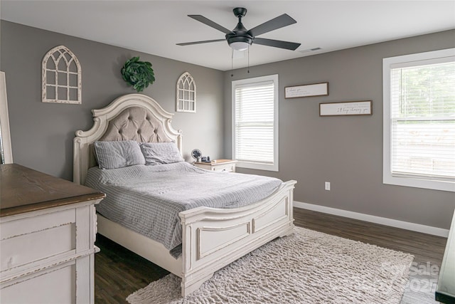 27 Sage Crest Loop, Weaverville, NC 28787 - bedroom featuring dark wood-style flooring, multiple windows, and baseboards