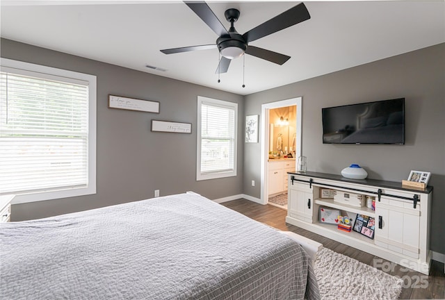 27 Sage Crest Loop, Weaverville, NC 28787 - bedroom featuring baseboards, dark wood-style floors, a ceiling fan, and ensuite bathroom