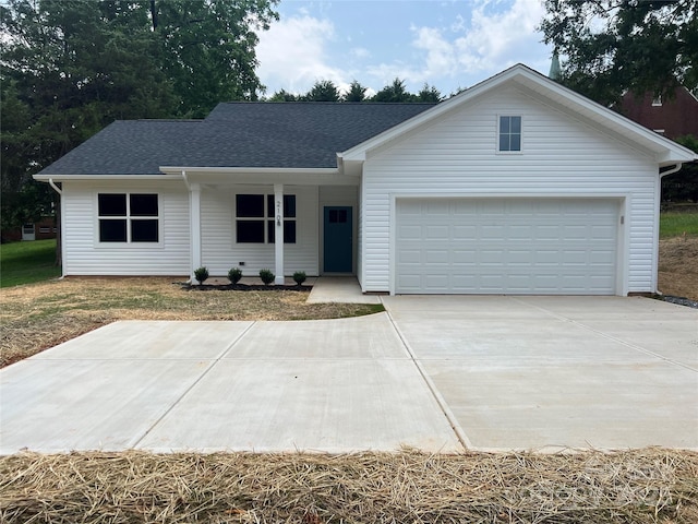 210 Johnson St, Troutman, NC 28116 - ranch-style house with roof with shingles, driveway, and an attached garage
