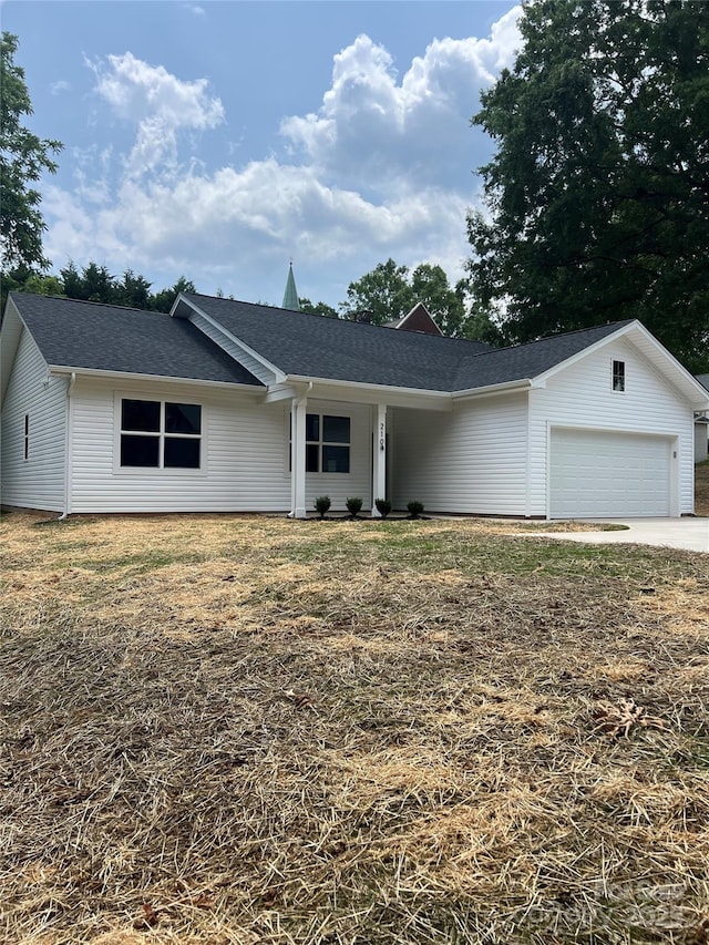 210 Johnson St, Troutman, NC 28116 - ranch-style house featuring a garage, a shingled roof, and concrete driveway