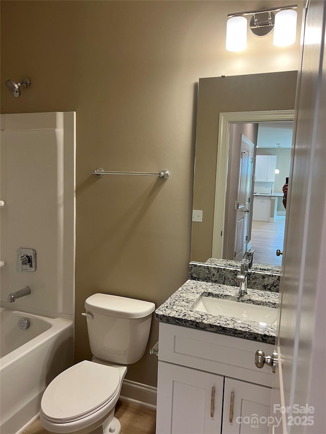 210 Johnson St, Troutman, NC 28116 - full bathroom featuring vanity, toilet, shower / tub combination, and baseboards