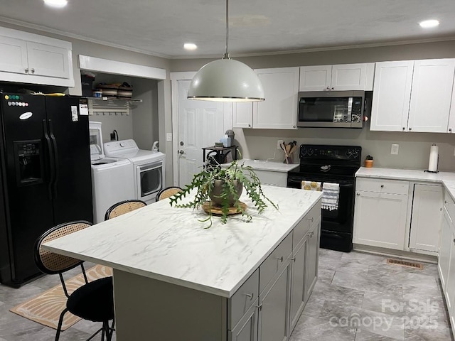199 Crowell Dr SW, Concord, NC 28025 - kitchen with black appliances, independent washer and dryer, white cabinets, crown molding, and recessed lighting