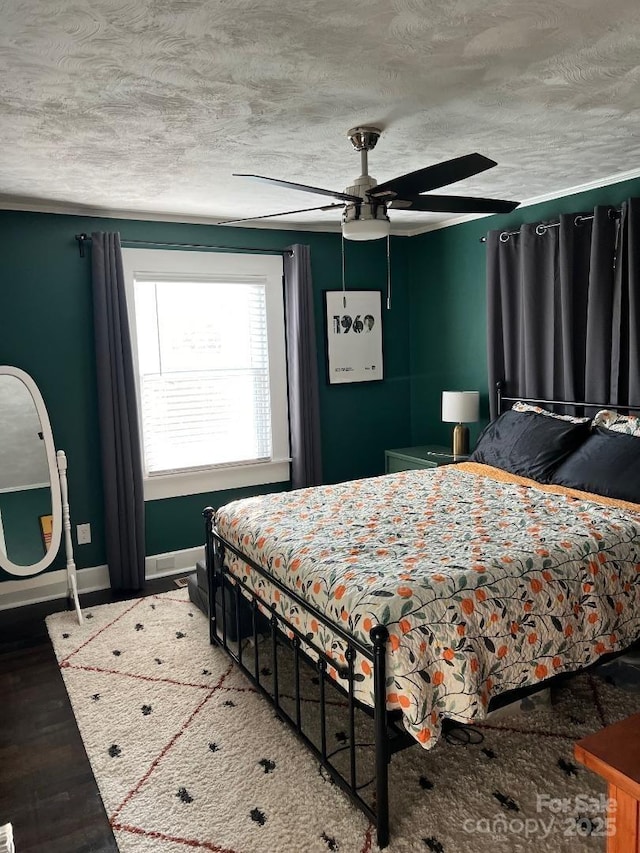 199 Crowell Dr SW, Concord, NC 28025 - bedroom featuring baseboards, wood finished floors, ceiling fan, and a textured ceiling