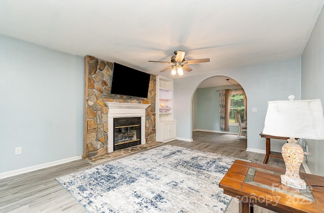 3884 Snider Cir, Hickory, NC 28602 - living room featuring arched walkways, a ceiling fan, wood finished floors, and baseboards