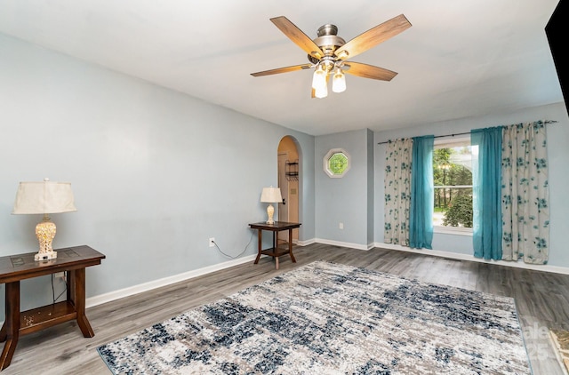 3884 Snider Cir, Hickory, NC 28602 - spare room with wood finished floors, arched walkways, baseboards, and a ceiling fan