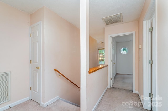 3884 Snider Cir, Hickory, NC 28602 - hallway with an upstairs landing, light colored carpet, and baseboards