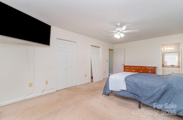 3884 Snider Cir, Hickory, NC 28602 - carpeted bedroom featuring baseboards, ensuite bath, and a ceiling fan