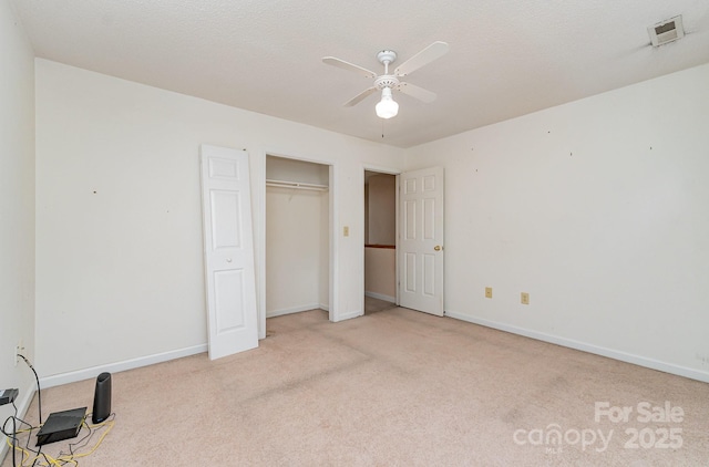 3884 Snider Cir, Hickory, NC 28602 - unfurnished bedroom featuring carpet flooring, baseboards, a closet, and a ceiling fan