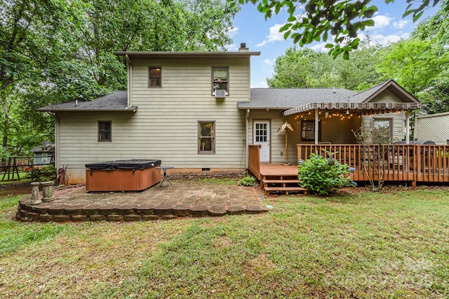 3884 Snider Cir, Hickory, NC 28602 - back of property featuring a hot tub, a patio area, a wooden deck, a lawn, and a chimney