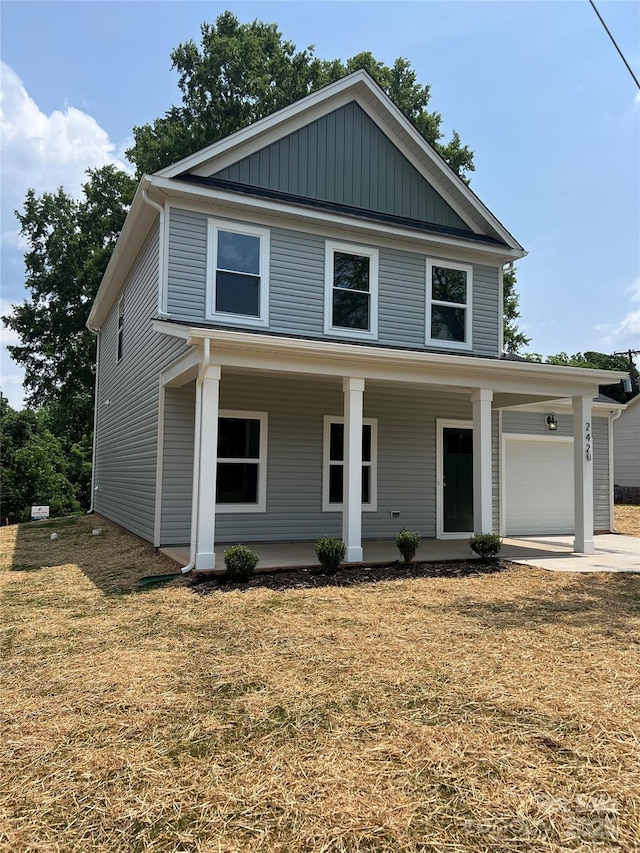 242 N Ave, Troutman, NC 28166 - view of front of house featuring covered porch, a front yard, and concrete driveway