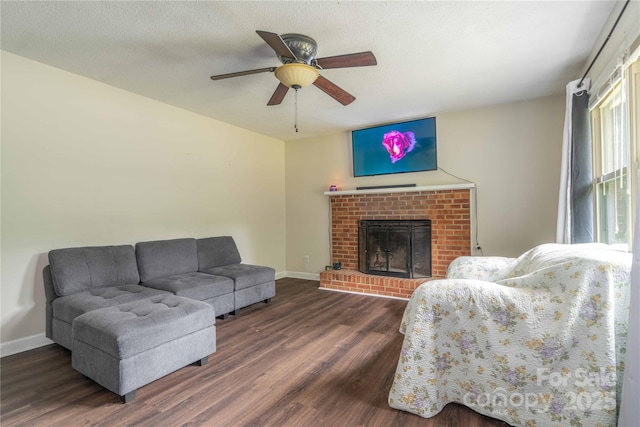 166 Stephanie Dr, Lexington, NC 27295 - living room featuring wood finished floors, ceiling fan, baseboards, and a brick fireplace