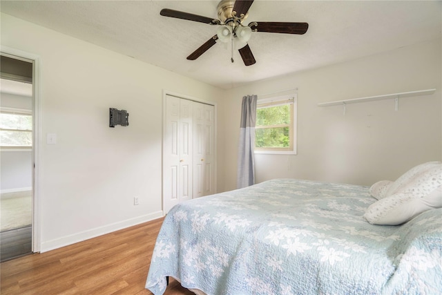 166 Stephanie Dr, Lexington, NC 27295 - bedroom with light wood-style flooring, baseboards, a closet, and ceiling fan