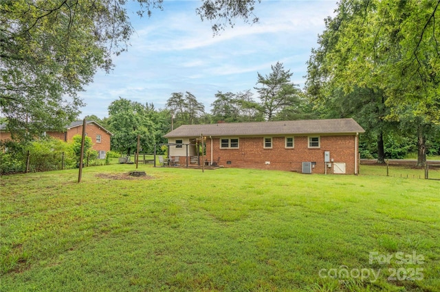 166 Stephanie Dr, Lexington, NC 27295 - rear view of property with cooling unit, brick siding, and a chimney