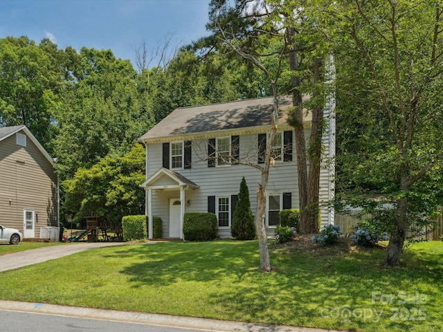 3313 Fortis Ln, Matthews, NC 28105 - colonial house featuring concrete driveway and a front lawn