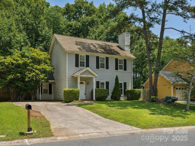 3313 Fortis Ln, Matthews, NC 28105 - colonial house with a chimney and concrete driveway