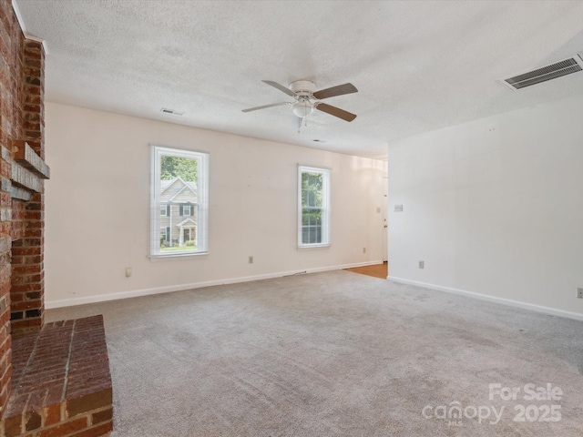 3313 Fortis Ln, Matthews, NC 28105 - unfurnished living room featuring ceiling fan, a textured ceiling, baseboards, carpet, and a brick fireplace