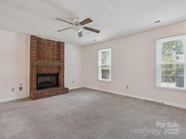 3313 Fortis Ln, Matthews, NC 28105 - unfurnished living room with healthy amount of natural light, a textured ceiling, a ceiling fan, carpet, and baseboards