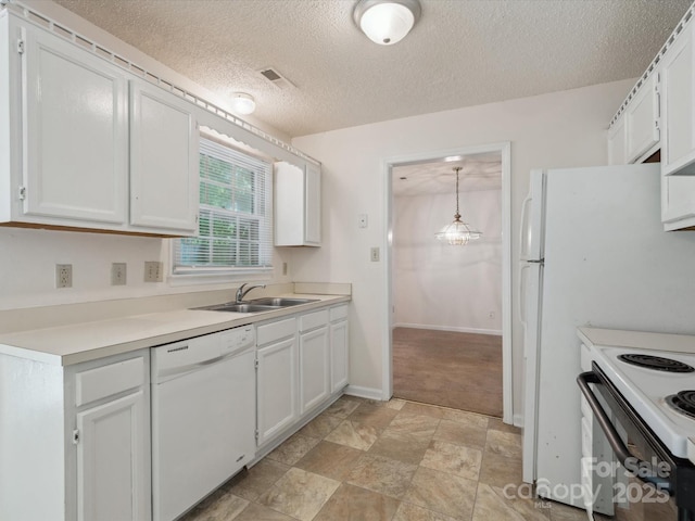 3313 Fortis Ln, Matthews, NC 28105 - kitchen with white appliances, a sink, white cabinets, light countertops, and a textured ceiling