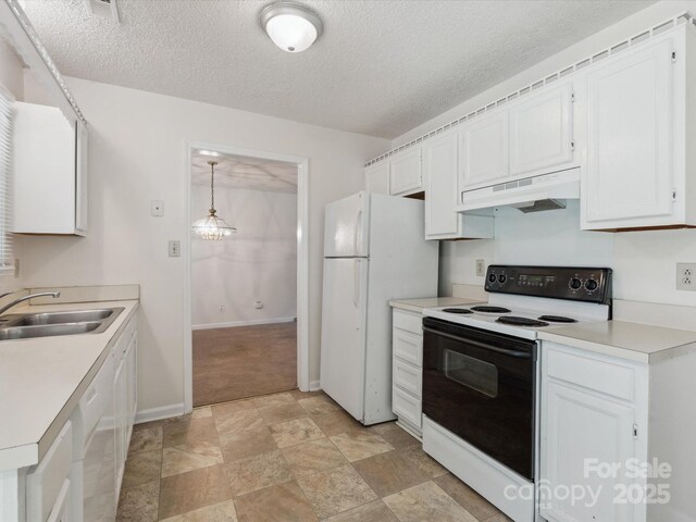 3313 Fortis Ln, Matthews, NC 28105 - kitchen with white appliances, under cabinet range hood, a sink, white cabinets, and light countertops