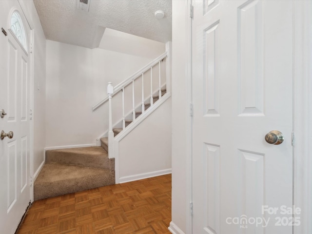 3313 Fortis Ln, Matthews, NC 28105 - staircase with a textured ceiling, baseboards, and carpet flooring