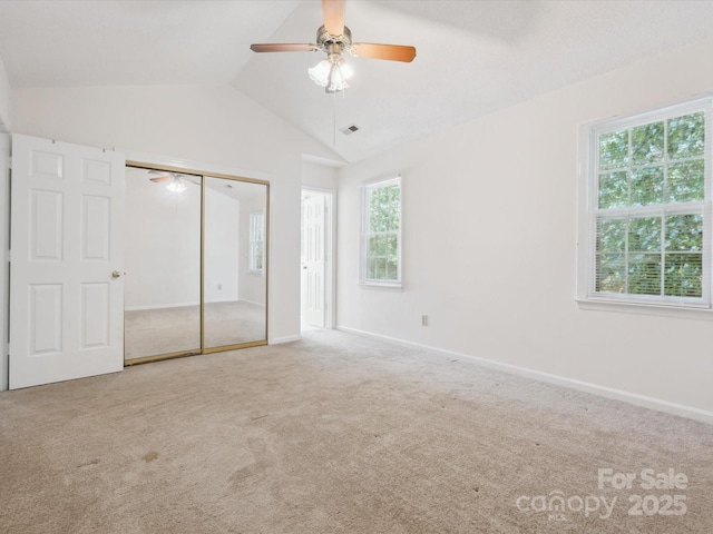 3313 Fortis Ln, Matthews, NC 28105 - unfurnished bedroom featuring vaulted ceiling, carpet flooring, a closet, baseboards, and a ceiling fan