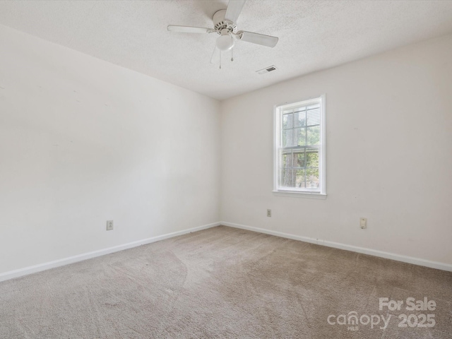 3313 Fortis Ln, Matthews, NC 28105 - unfurnished room with carpet, a ceiling fan, baseboards, and a textured ceiling