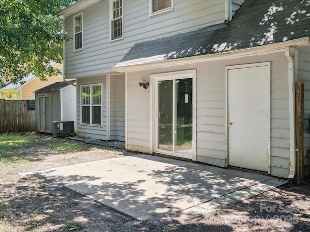 3313 Fortis Ln, Matthews, NC 28105 - rear view of house featuring a patio, central AC unit, and a shingled roof