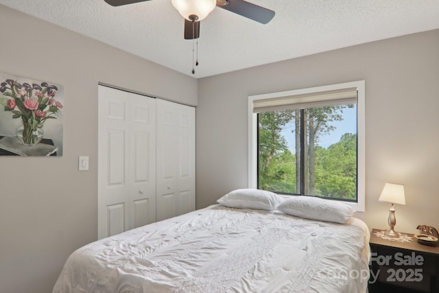 44 Falls Creek Rd, Pisgah Forest, NC 28768 - bedroom with a closet, ceiling fan, and a textured ceiling