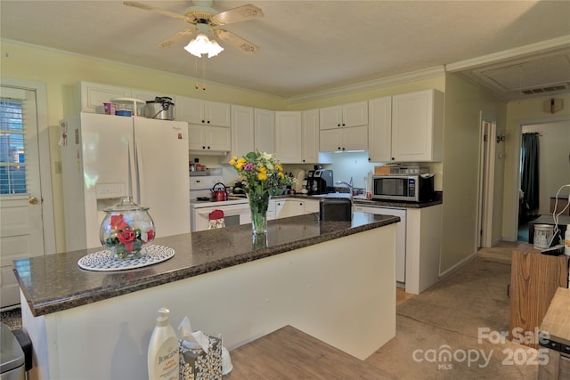 252 Chuckwood Rd, Mooresville, NC 28117 - kitchen with white appliances, white cabinets, ceiling fan, dark stone counters, and a kitchen island