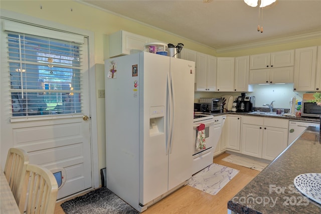 252 Chuckwood Rd, Mooresville, NC 28117 - kitchen with white appliances, crown molding, light wood-style flooring, a sink, and white cabinetry