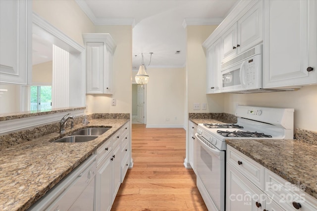 5601 Fairview Rd Unit 11, Charlotte, NC 28209 - kitchen with white appliances, a sink, light wood-type flooring, white cabinets, and crown molding