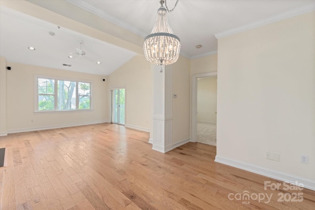 5601 Fairview Rd Unit 11, Charlotte, NC 28209 - spare room featuring light wood-style floors, a chandelier, ornamental molding, baseboards, and vaulted ceiling